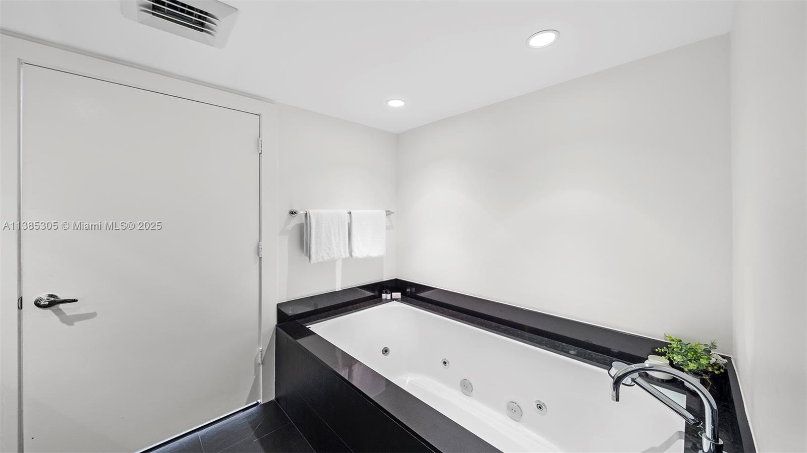 101 20th Street, Unit 3903 Miami Beach, FL 33139 - Photo 42 of 46 a bathroom with a bathtub and shower