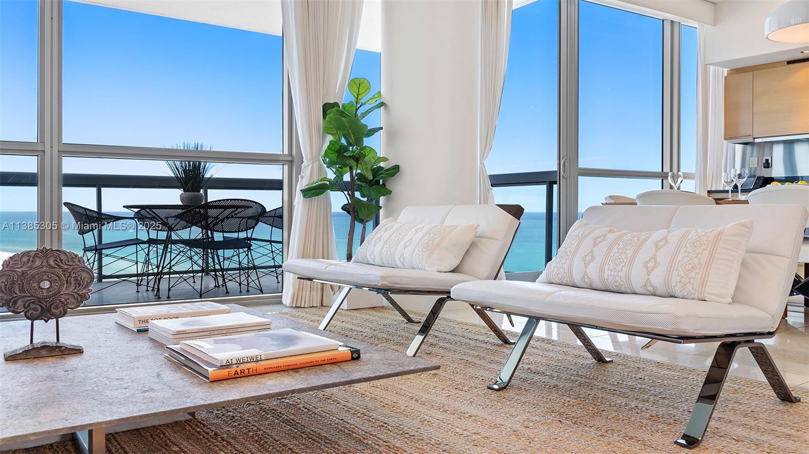 101 20th Street, Unit 3903 Miami Beach, FL 33139 - Photo 6 of 46 a living room with furniture and a potted plant