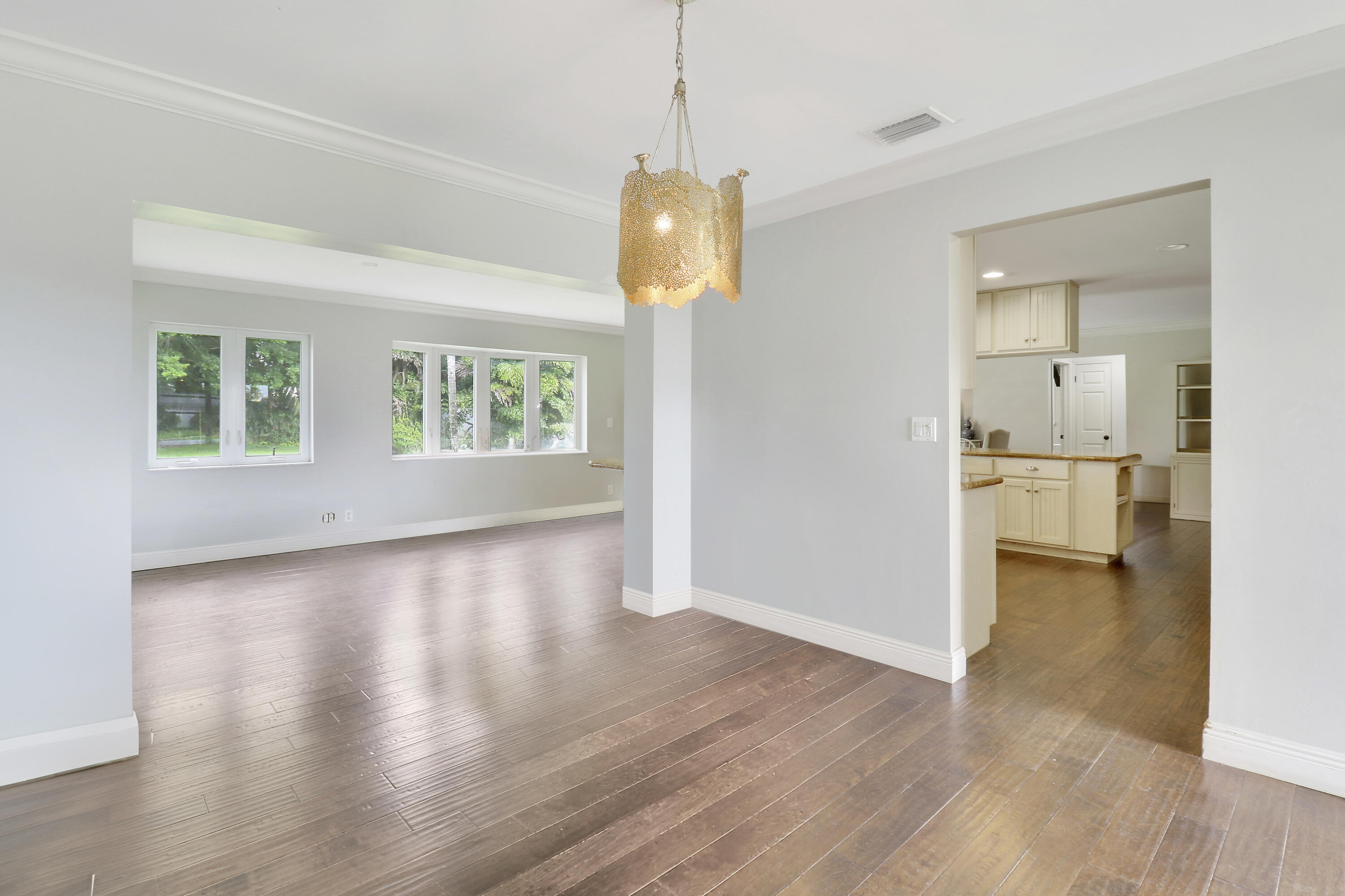 749 Cruiser Road North North Palm Beach, FL 33408 - Photo 15 of 46 a view of a room with wooden floor and window