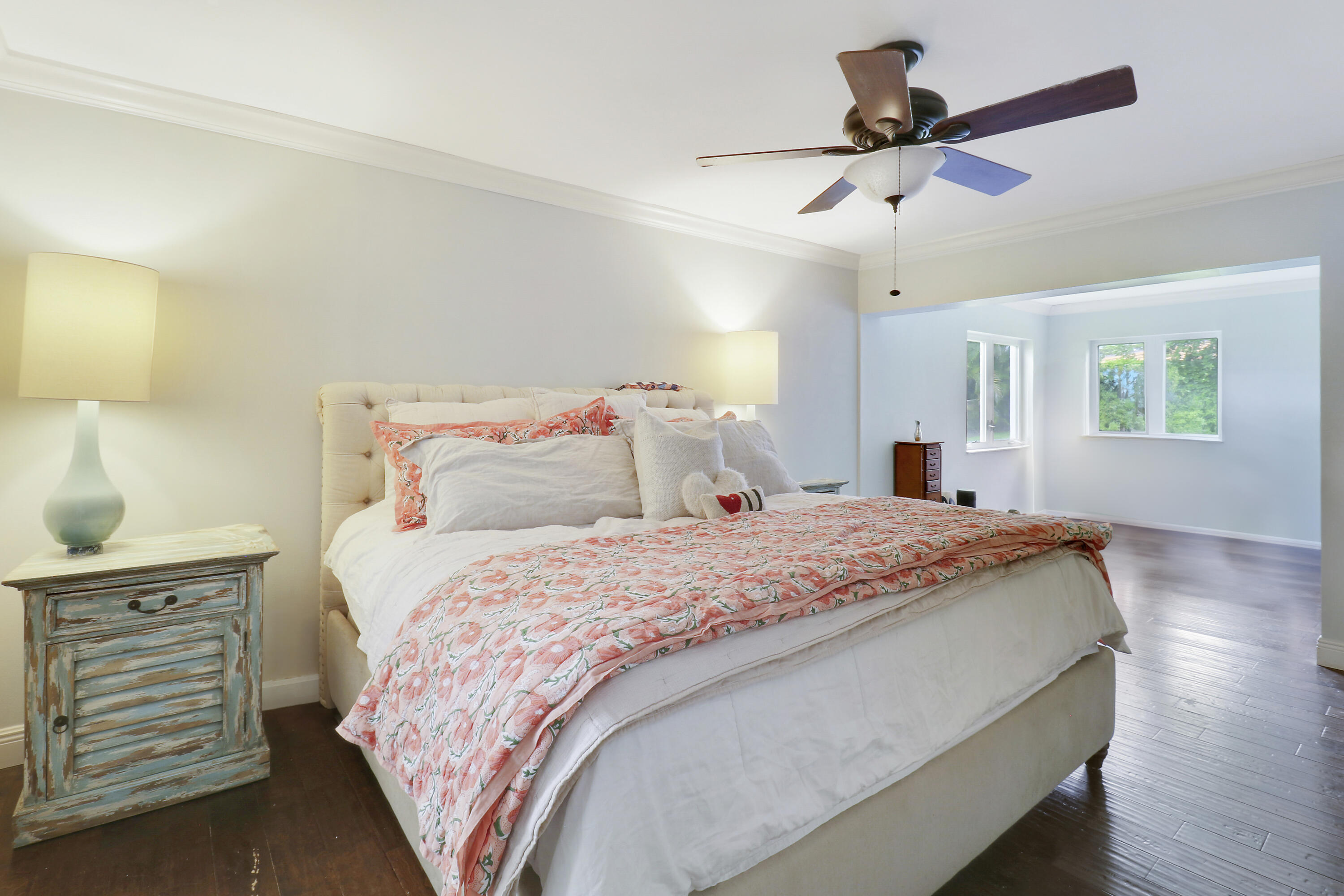 749 Cruiser Road North North Palm Beach, FL 33408 - Photo 18 of 46 a bedroom with a bed a chandelier and a dresser