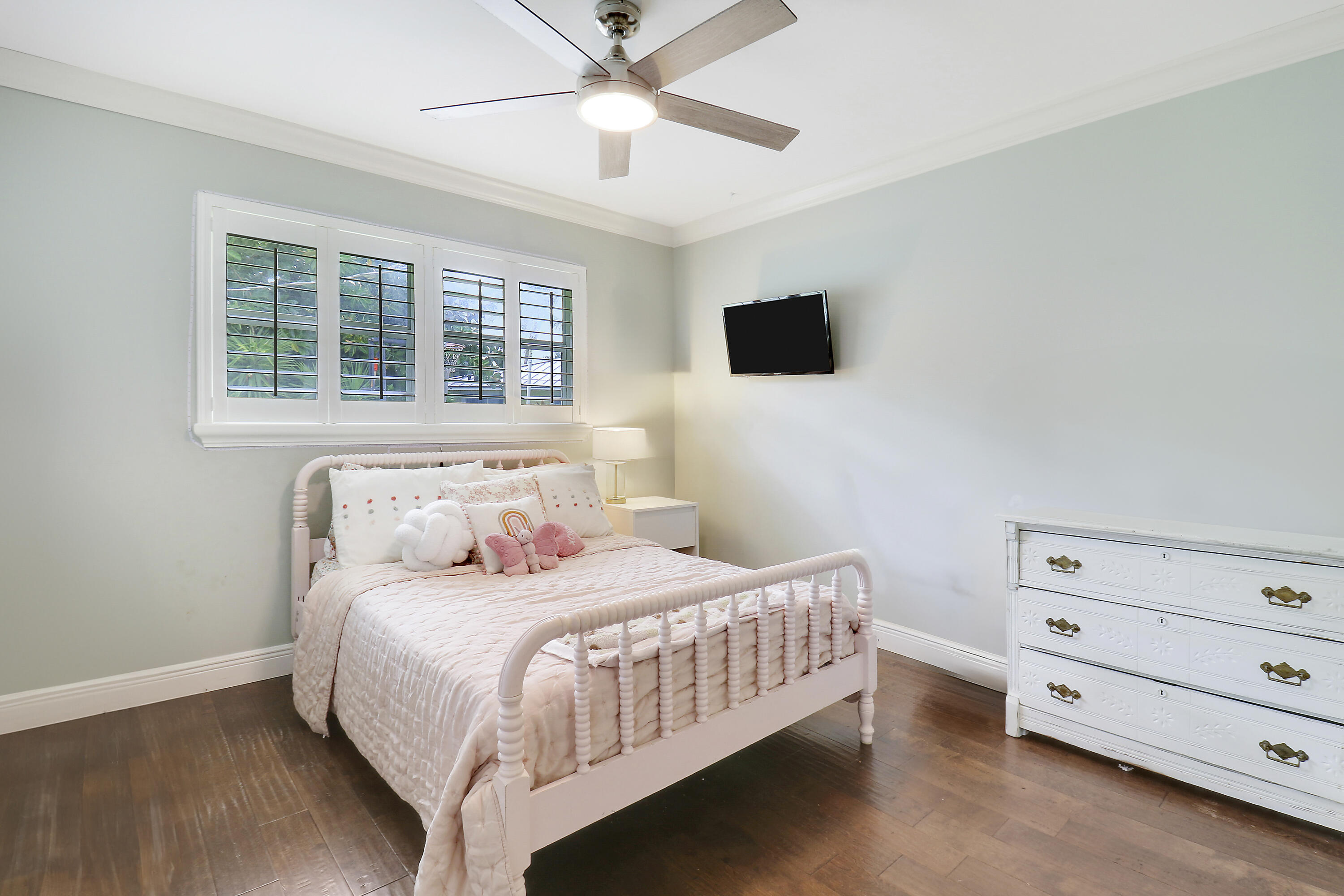 749 Cruiser Road North North Palm Beach, FL 33408 - Photo 21 of 46 a bedroom with a bed and a tv
