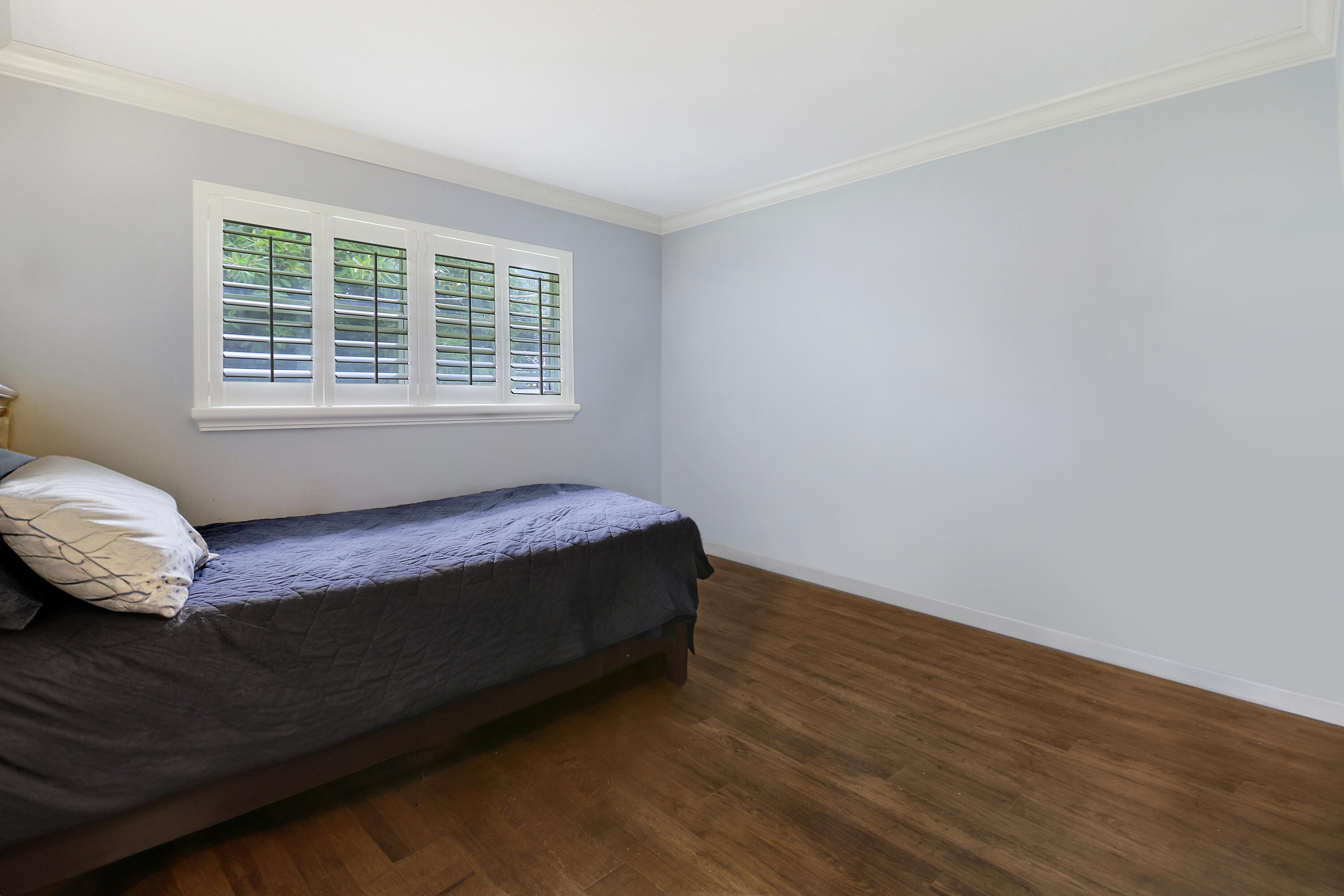 749 Cruiser Road North North Palm Beach, FL 33408 - Photo 24 of 46 a bedroom with a bed and a window