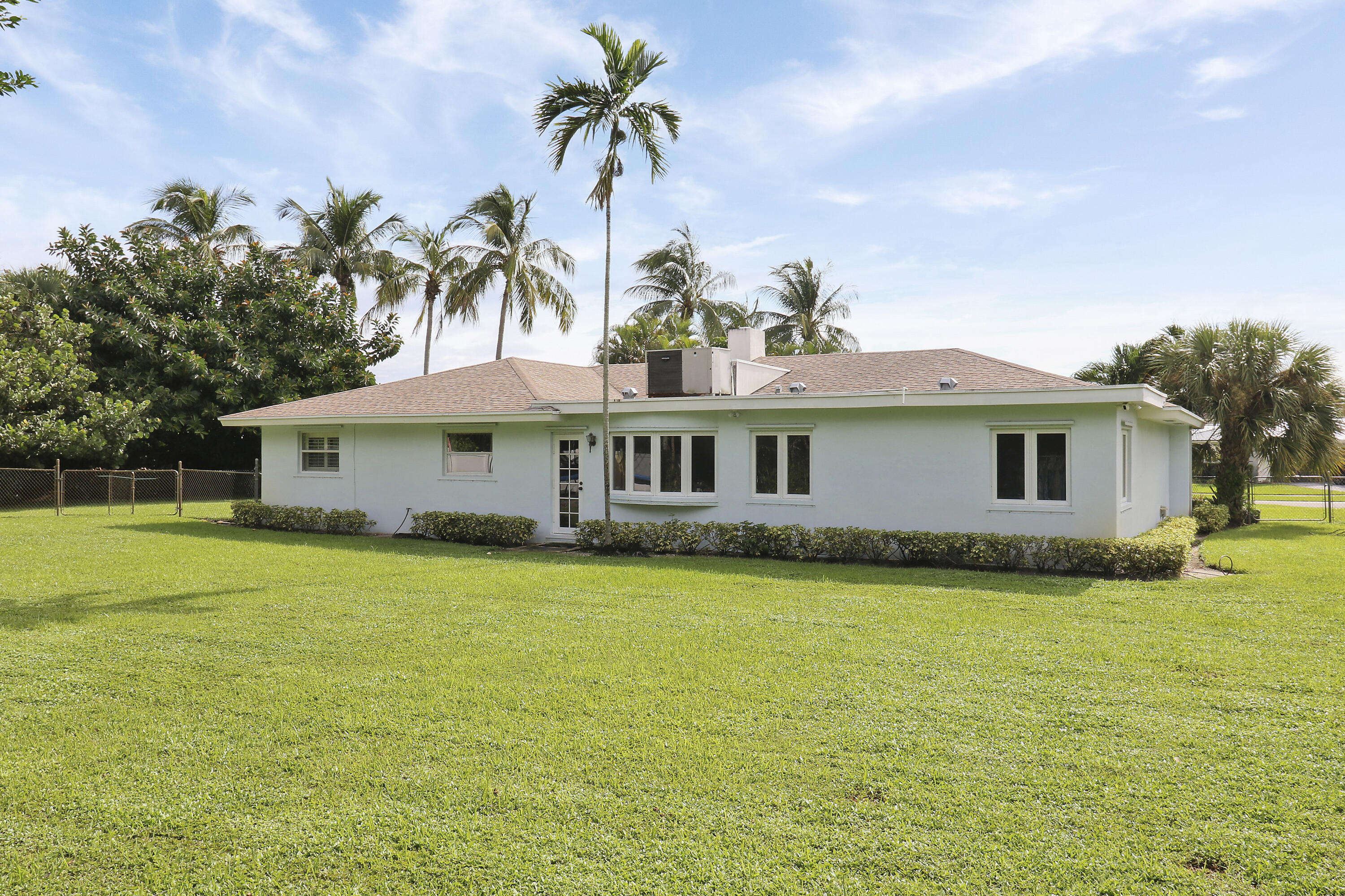 749 Cruiser Road North North Palm Beach, FL 33408 - Photo 31 of 46 a front view of a house with garden