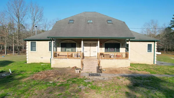 front view of a house with a yard