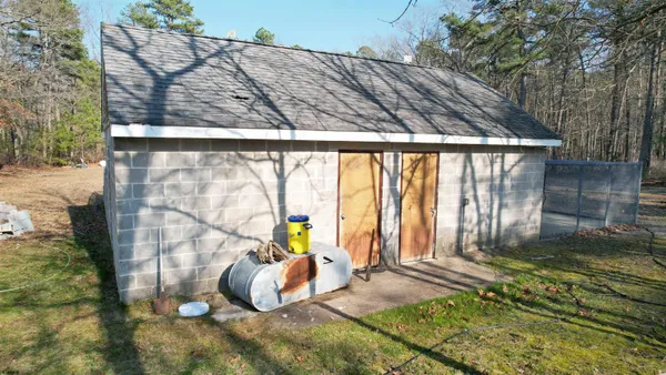 a view of a backyard of the house