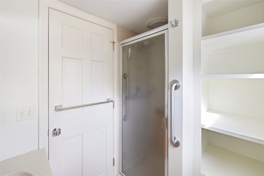 270 Buckeye Brook Road Charlestown, RI 02813 - Photo 20 of 45 First floor bathroom, shower stall and plenty of shelving