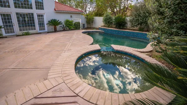 a view of swimming pool from a balcony