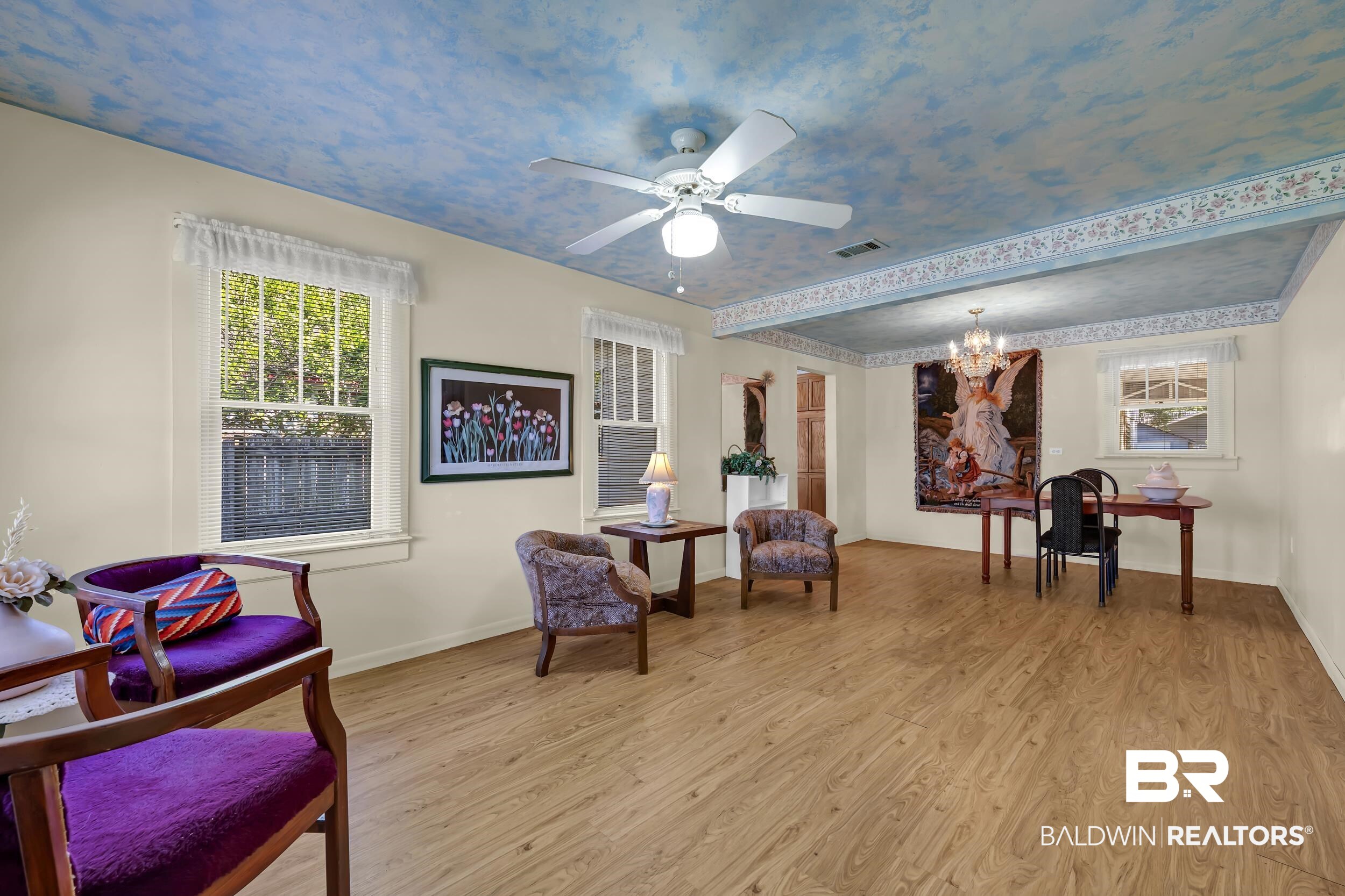 304 West Myrtle Avenue Foley, AL 36535 - Photo 3 of 29 Spacious interior featuring wood-finish flooring, a decorative ceiling with a central fan light, and multiple windows