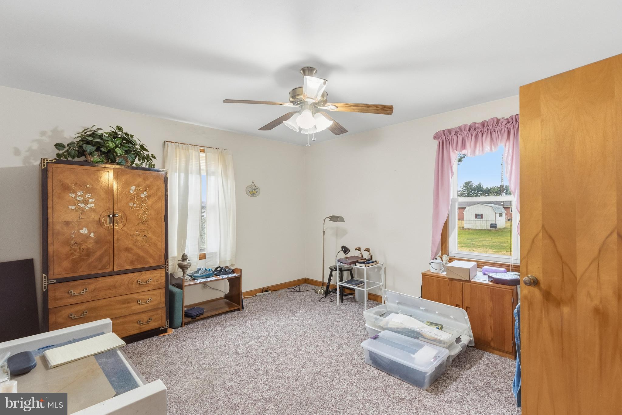 961 Canterbury Road Milford, DE 19963 - Photo 11 of 27 a living room with furniture and a chandelier