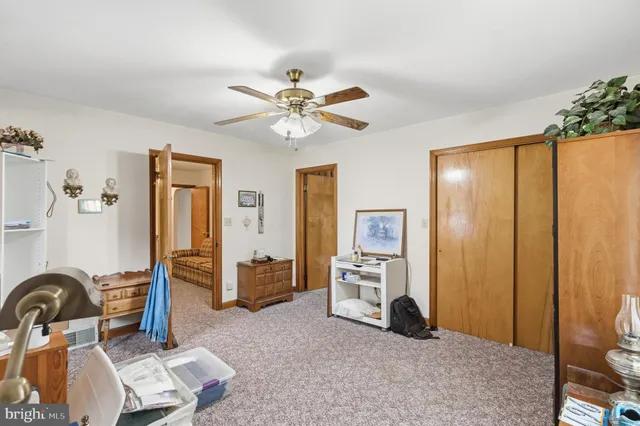 a bedroom with furniture and a chandelier