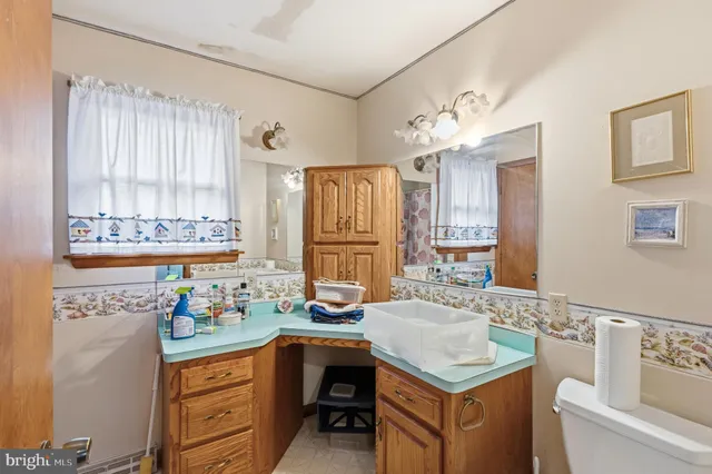 a room with a refrigerator and cabinets