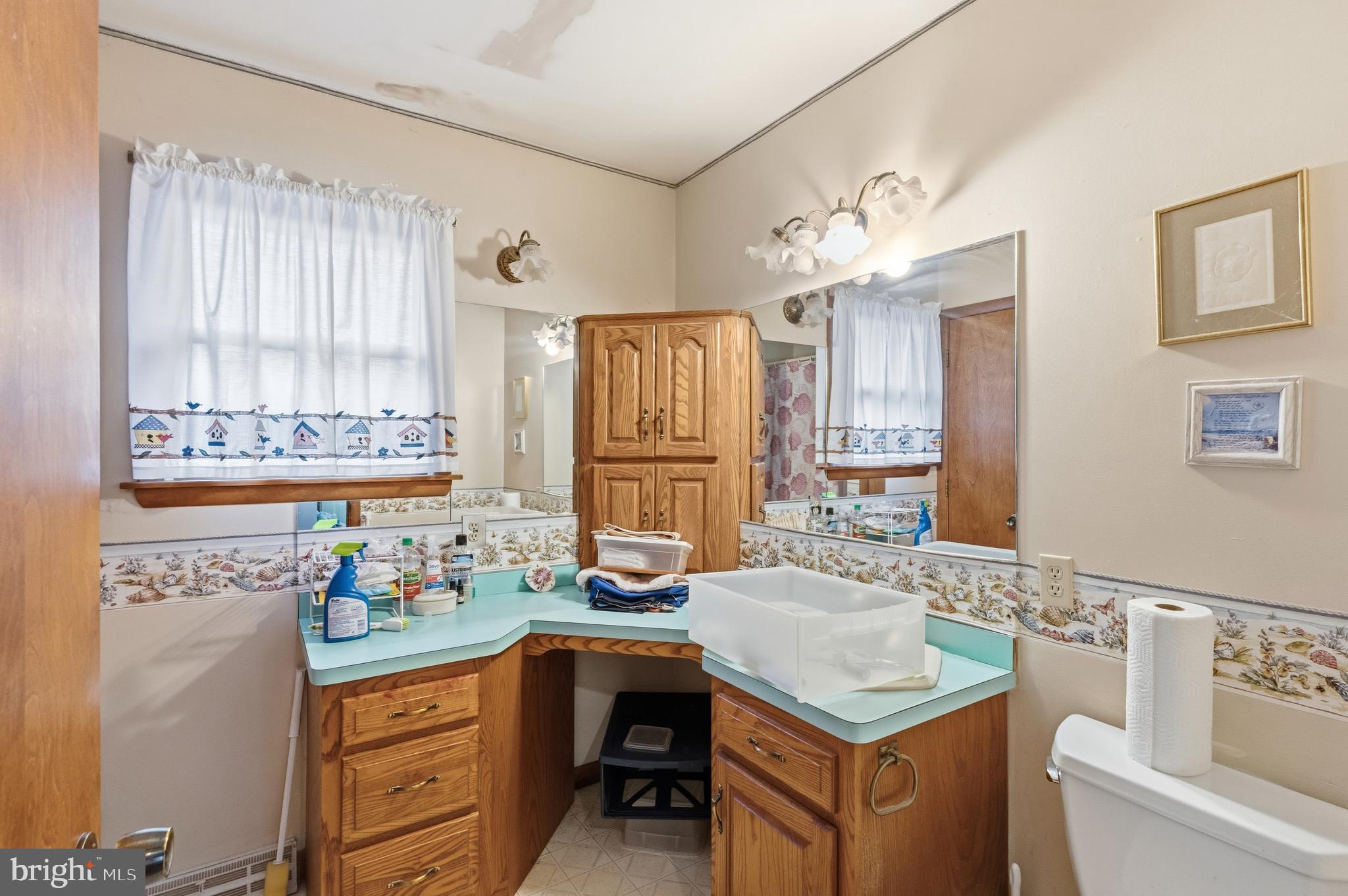 961 Canterbury Road Milford, DE 19963 - Photo 14 of 27 a kitchen with a stove a sink and a refrigerator