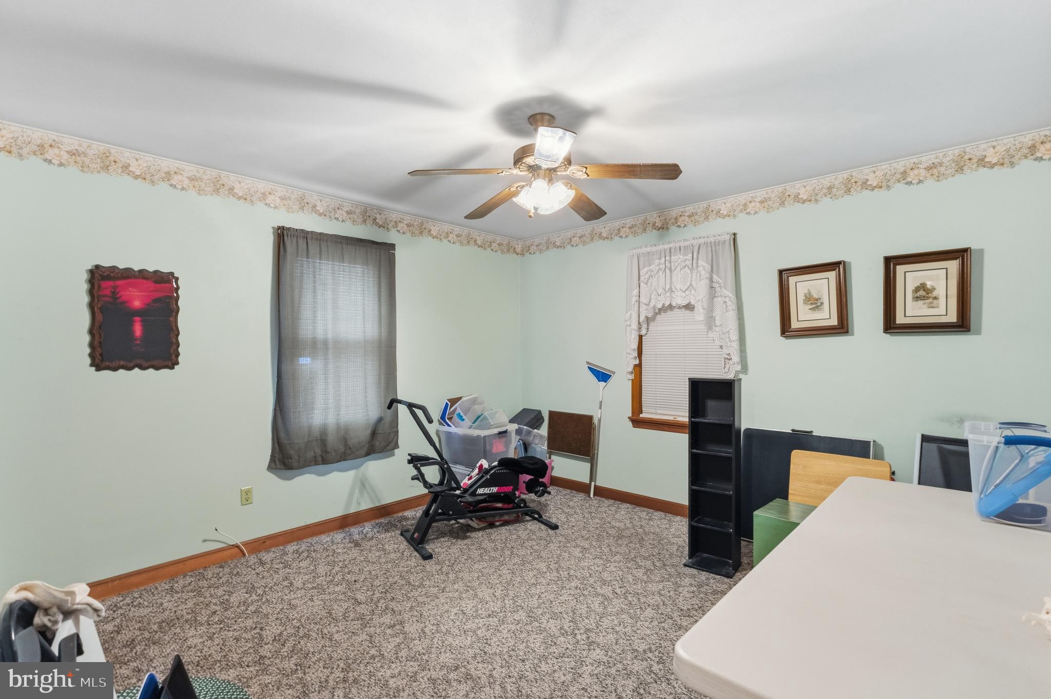 961 Canterbury Road Milford, DE 19963 - Photo 16 of 27 a living room with furniture and a dining table
