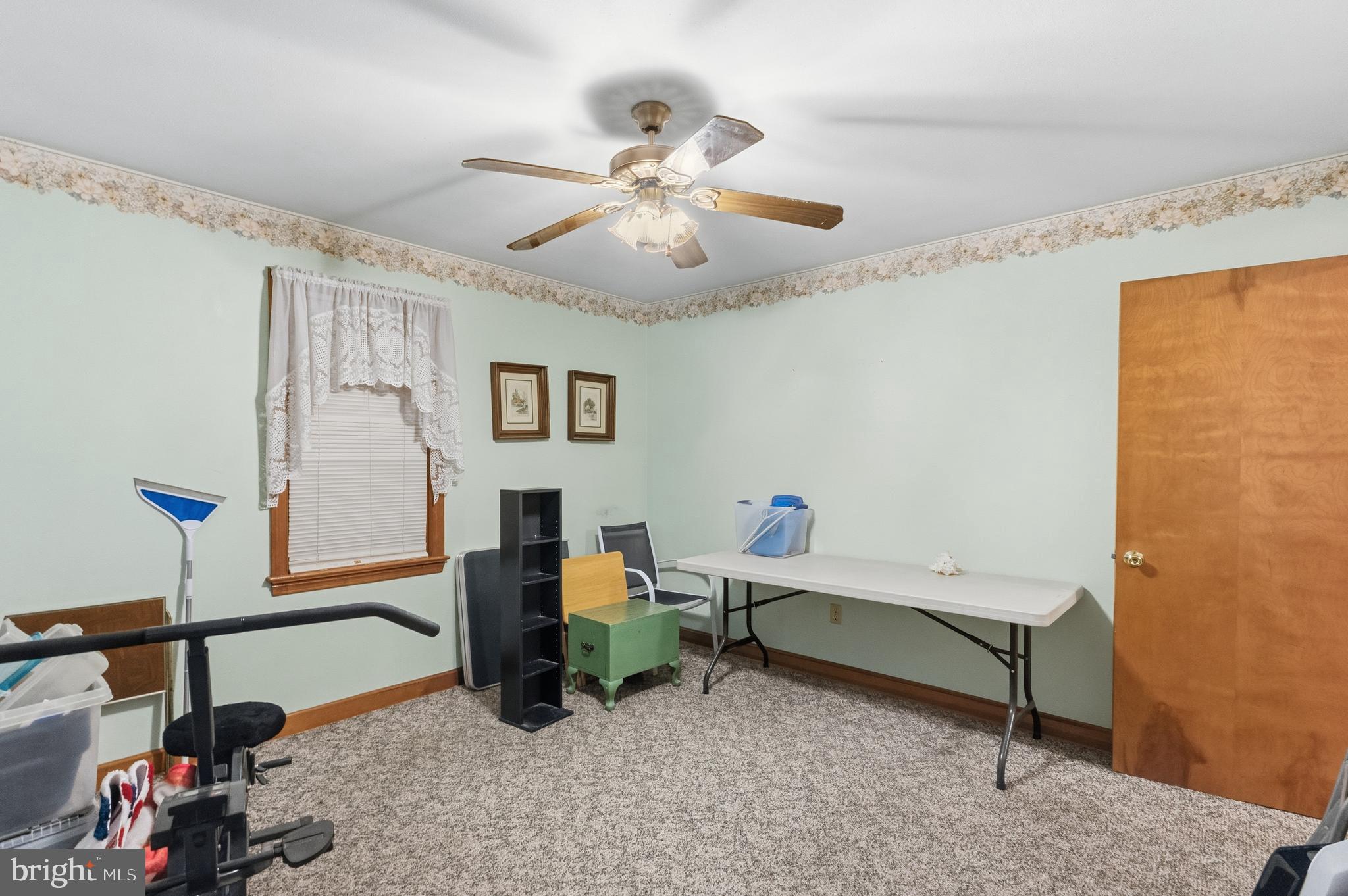 961 Canterbury Road Milford, DE 19963 - Photo 17 of 27 a living room with furniture and a chandelier