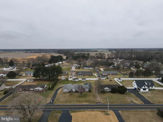 an aerial view of a house with backyard