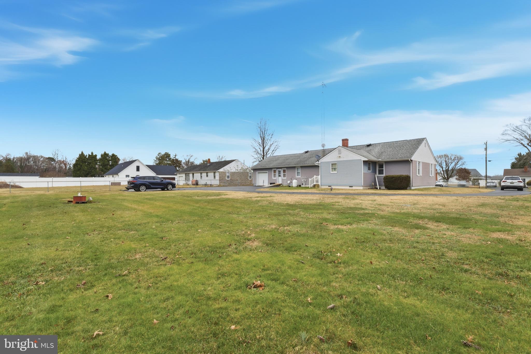961 Canterbury Road Milford, DE 19963 - Photo 23 of 27 a swimming pool is in the middle of a field