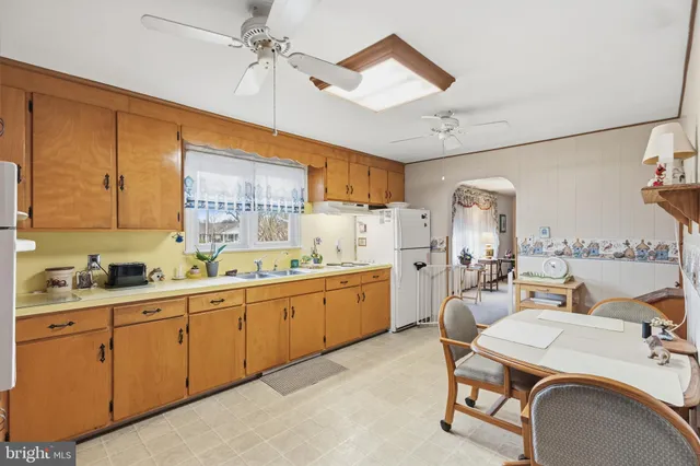 a kitchen with cabinets a sink and appliances