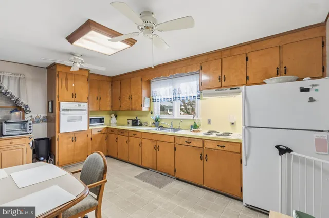 a view of a livingroom with furniture and a window