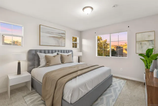 a bedroom with bed and a window