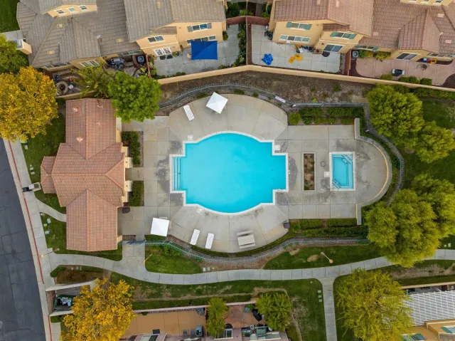 an aerial view of a house with garden space and street view