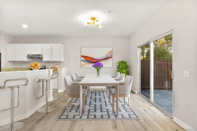 a living room with dining table furniture and a window