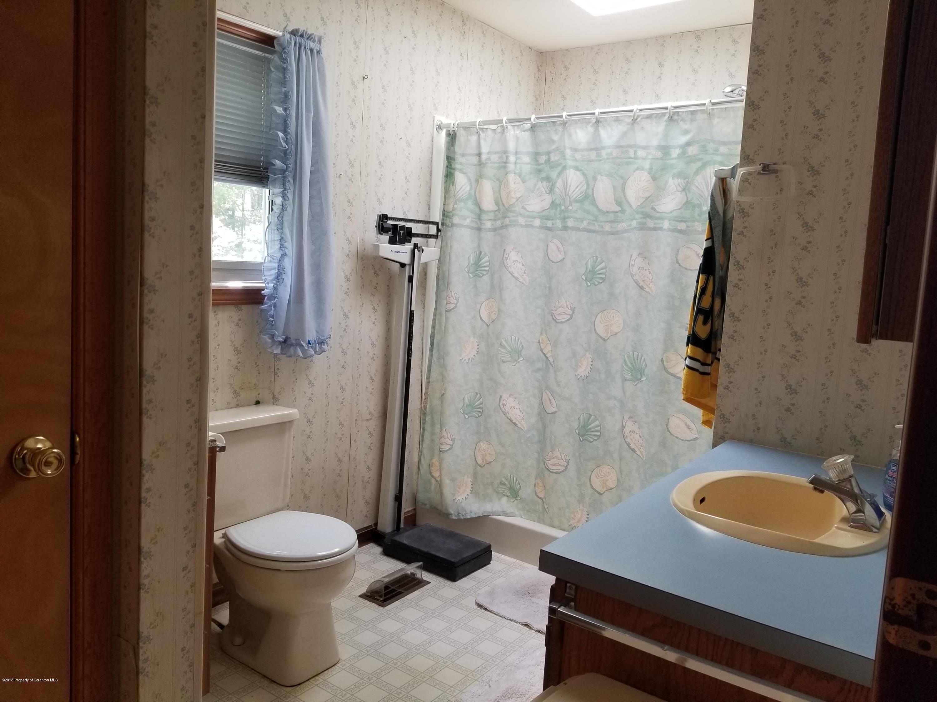 1774 State Rte 2004 Nicholson, PA 18446 - Photo 6 of 9 a bathroom with a sink and a mirror