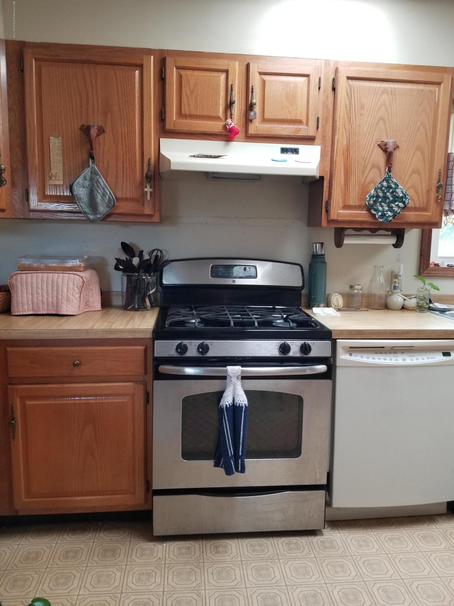 1774 State Rte 2004 Nicholson, PA 18446 - Photo 7 of 9 a stove top oven sitting inside of a kitchen