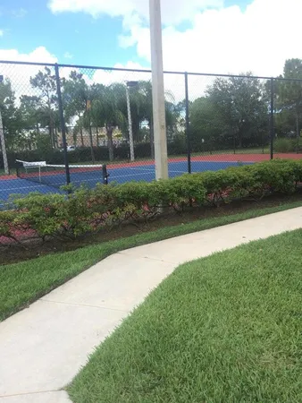 a view of park with tall trees