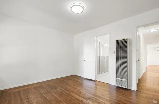 a bathroom with a tub and shower