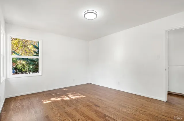 a bathroom with a sink a mirror and shower