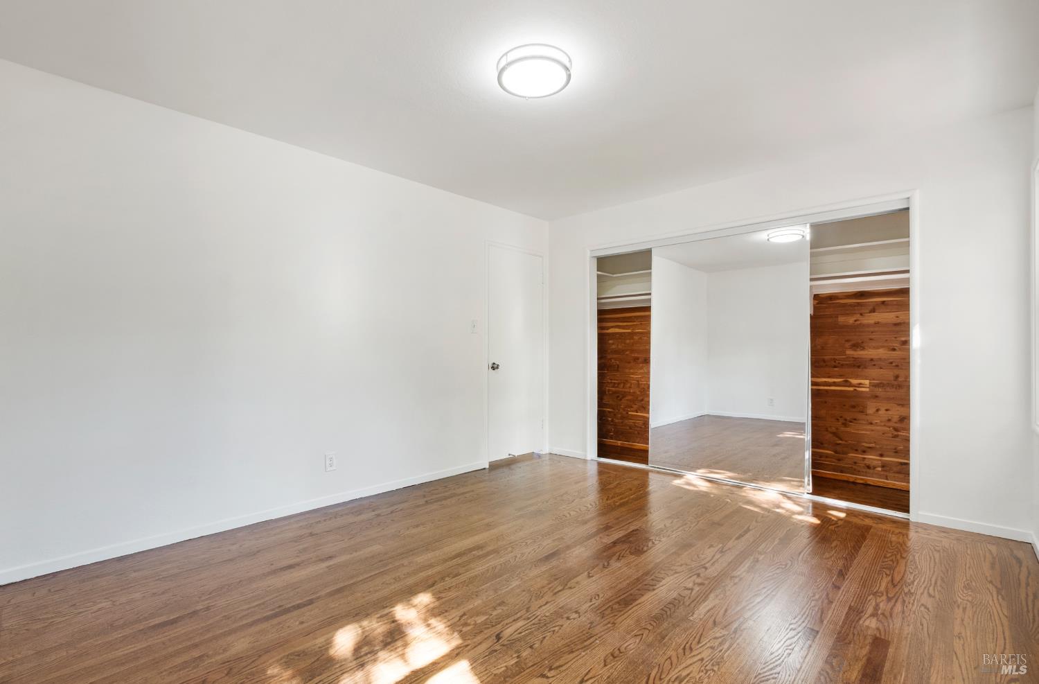 23 Valley View Court El Sobrante, CA 94803 - Photo 34 of 69 Bedroom 3 with glass doors in closet and cedar in closet.