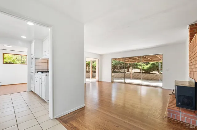 a view of an entryway with wooden floor