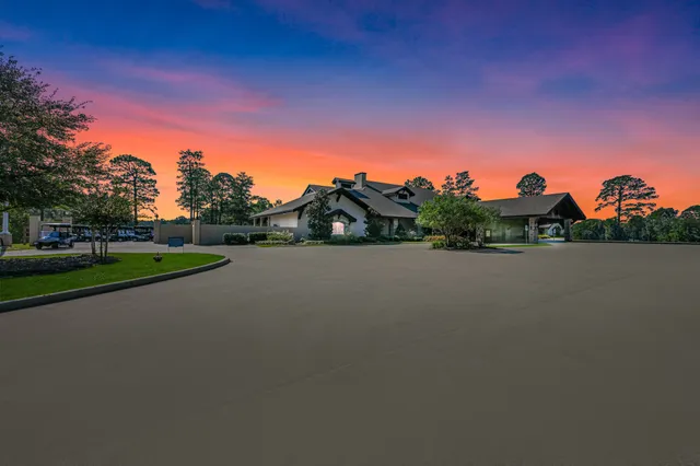an aerial view of a houses with a yard