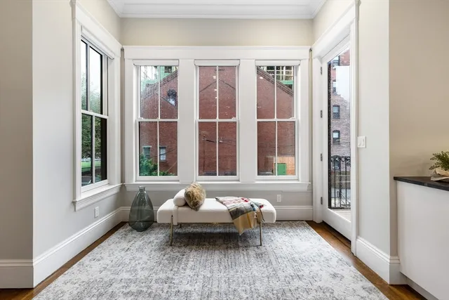 a living room with furniture and windows