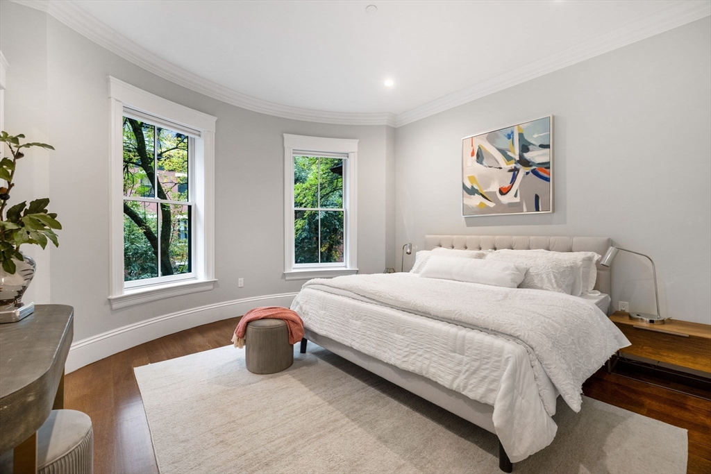 82 Worcester Street, Unit 2 Boston, MA 02118 - Photo 16 of 32 a bedroom with a bed a painting and a window