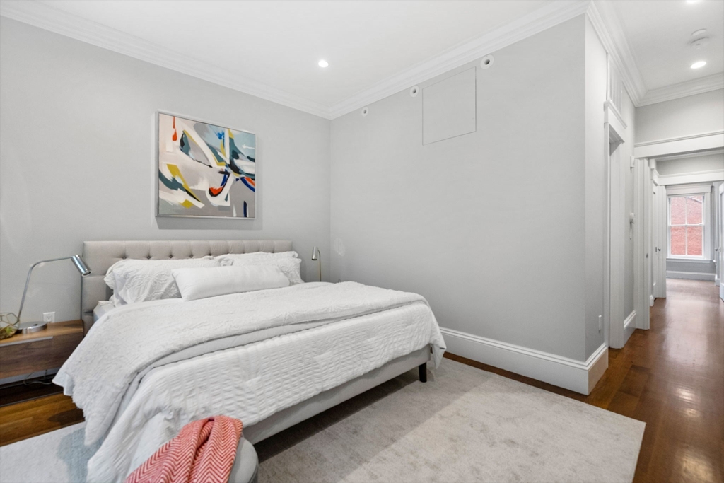 82 Worcester Street, Unit 2 Boston, MA 02118 - Photo 17 of 32 a bedroom with a bed and painting on the wall