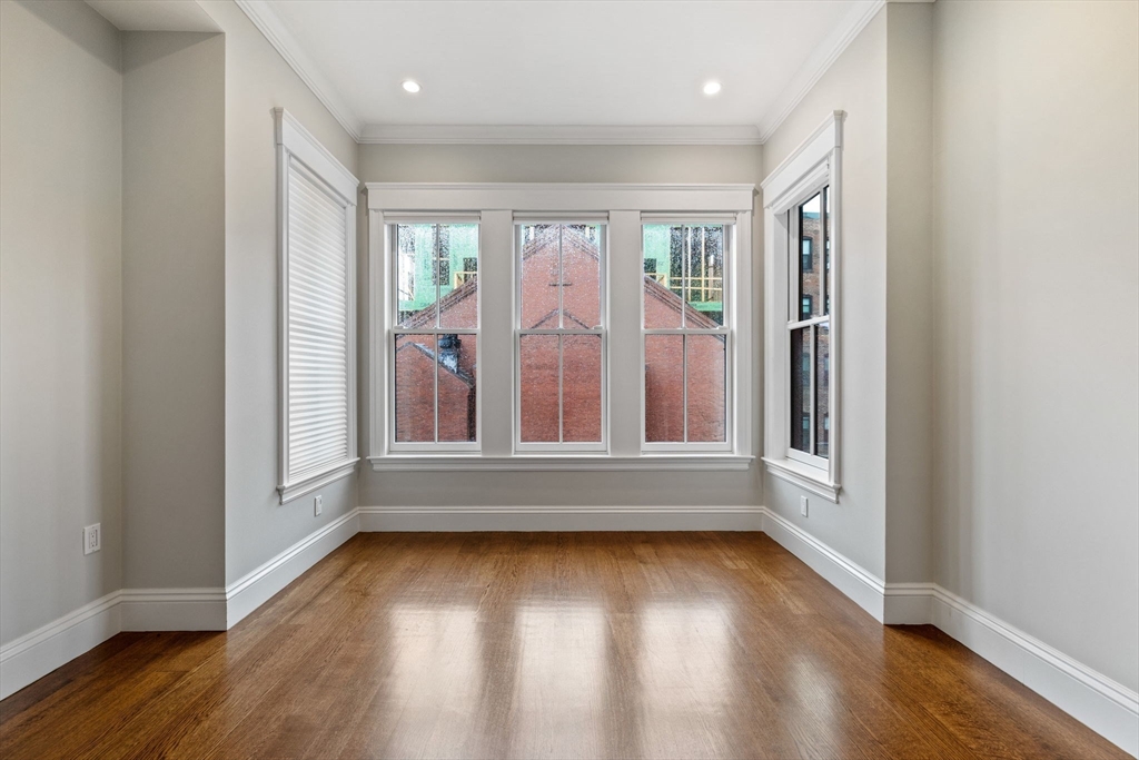 82 Worcester Street, Unit 2 Boston, MA 02118 - Photo 23 of 32 wooden floor in an empty room with a window
