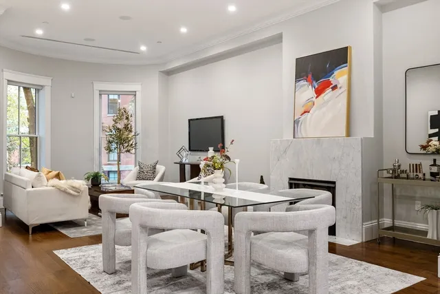 a living room with fireplace furniture and a flat screen tv