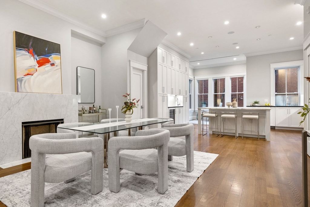 82 Worcester Street, Unit 2 Boston, MA 02118 - Photo 7 of 32 a dining hall with stainless steel appliances kitchen island granite countertop a dining table chairs and view living room
