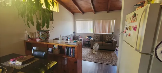 a bedroom with a bed and a night stand