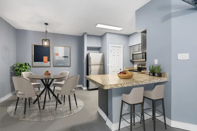 a view of a dining room and chairs