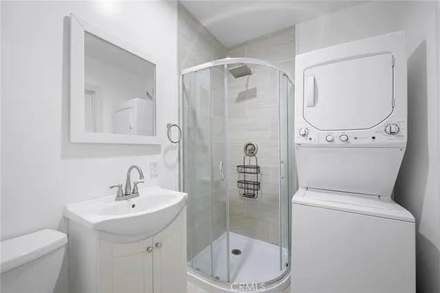 a bathroom with a toilet sink and shower