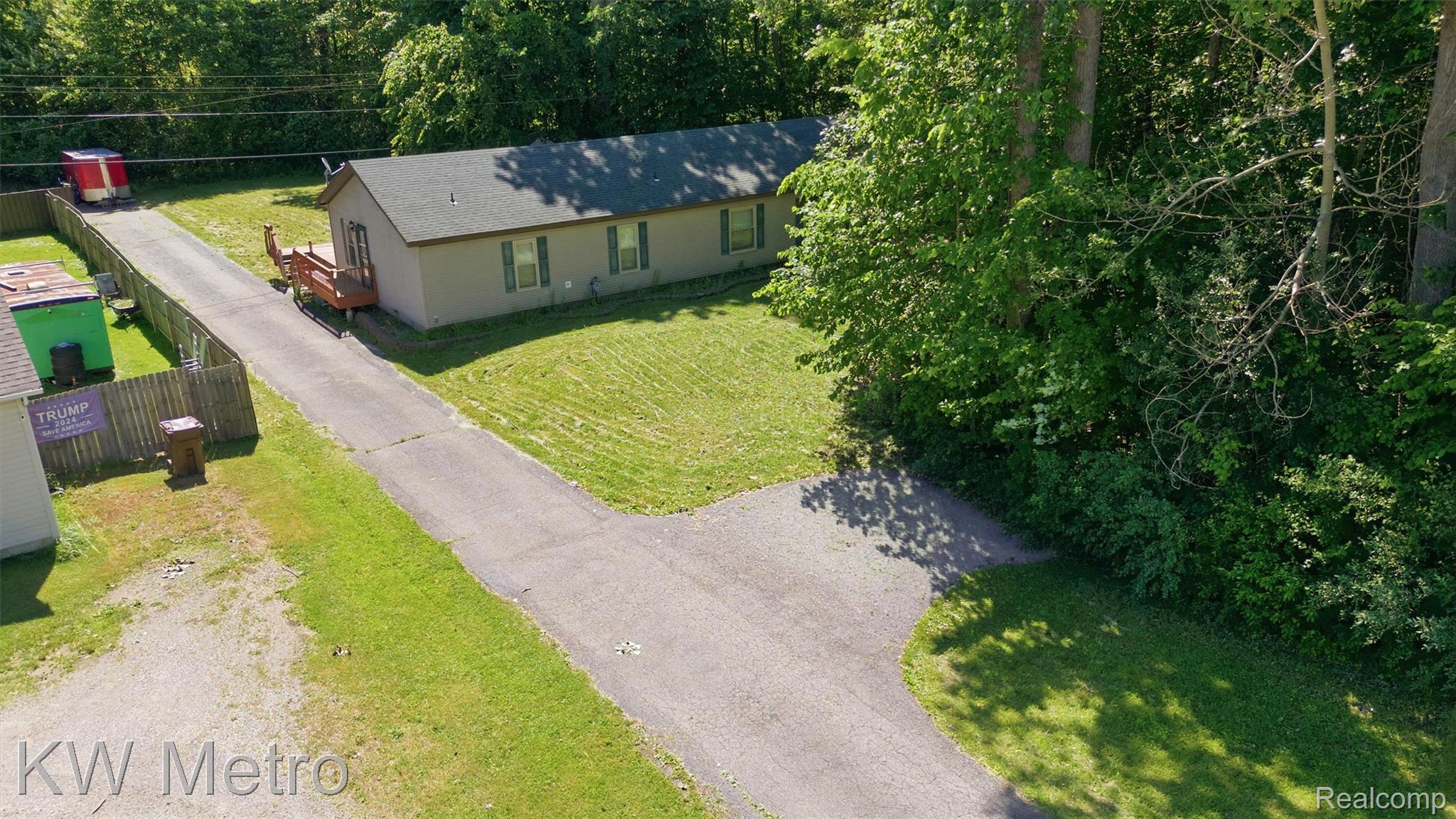 22733 Sumpter Road Belleville, MI 48111 - Photo 39 of 52 Single-story residence featuring a gray exterior siding and a dark shingle roof