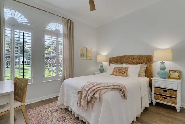 front view of a house with a yard and a garage