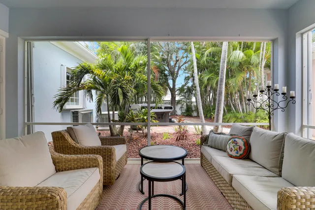 a front view of a house with a garden and plants