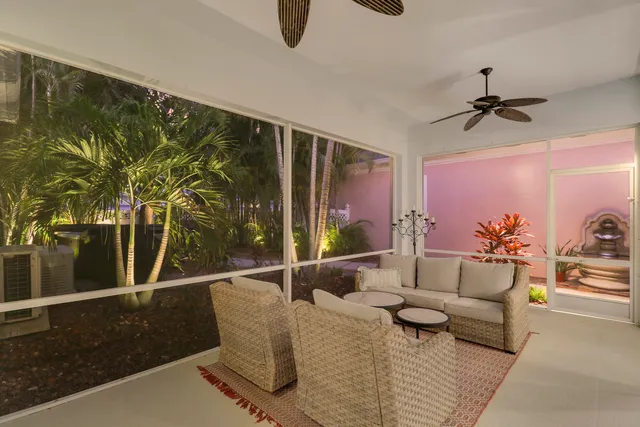 a pathway of a building with a yard