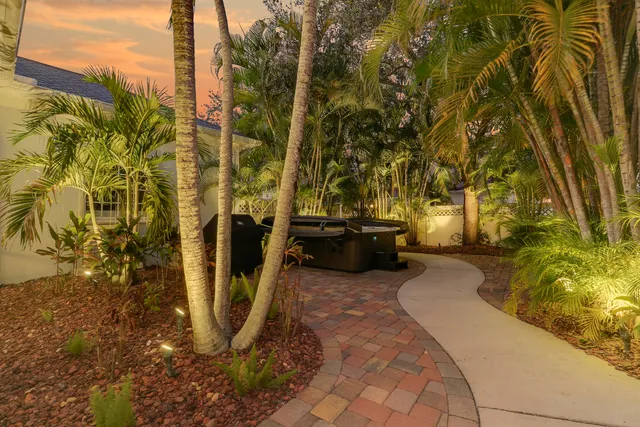 an aerial view of a house with swimming pool garden and patio