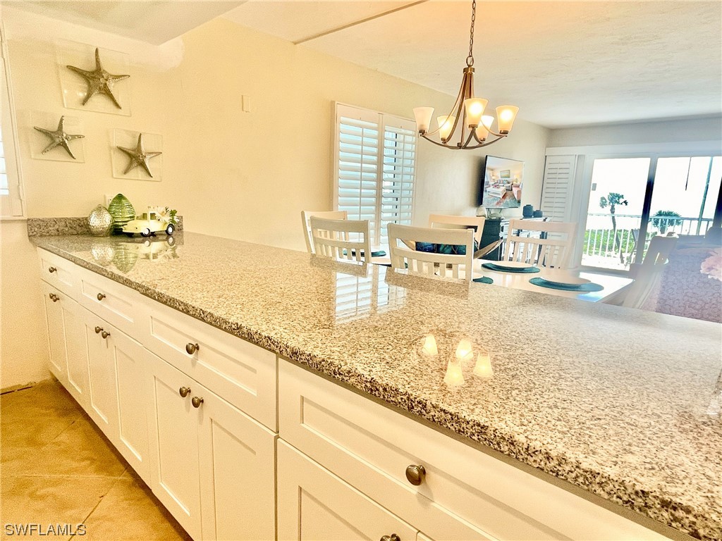 2521 Beach Villas Captiva, FL 33924 - Photo 18 of 50 a kitchen with sink and view of living room
