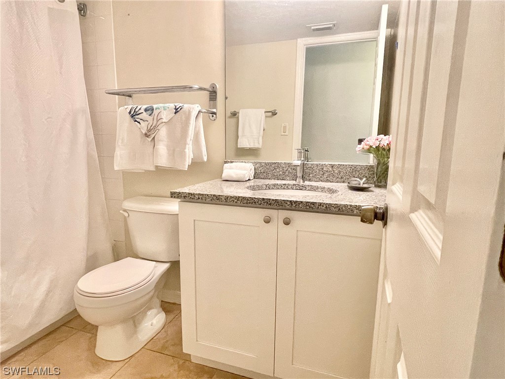 2521 Beach Villas Captiva, FL 33924 - Photo 34 of 50 a bathroom with a granite countertop toilet sink and mirror