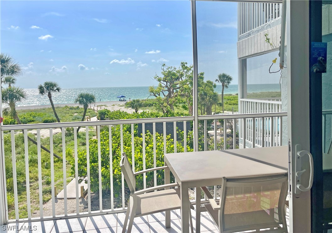 2521 Beach Villas Captiva, FL 33924 - Photo 4 of 50 a view of a balcony dining area with furniture